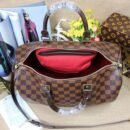 "Timeless Elegance: Louis Vuitton Medium Handbag - 30x20x18 cm"