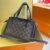 "Luxury Companion: Louis Vuitton Handbag - Where Style Meets Signature" - black