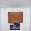 "Refined Essentials: High-Quality Men's Wallets from Gucci, Montblanc, and Prada"
