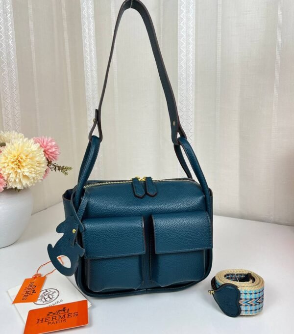 Unveil the epitome of luxury with our Hermes Shoulder Bag featuring a versatile sling strap, with original box