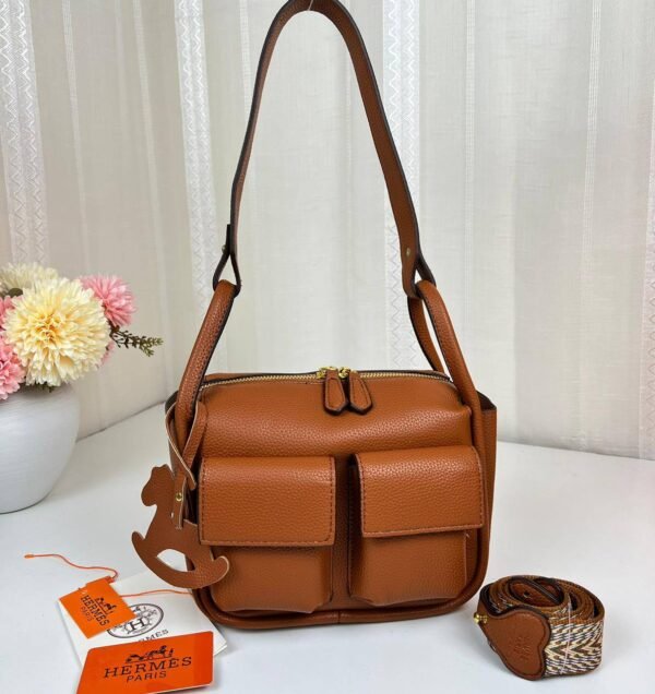 Unveil the epitome of luxury with our Hermes Shoulder Bag featuring a versatile sling strap, with original box