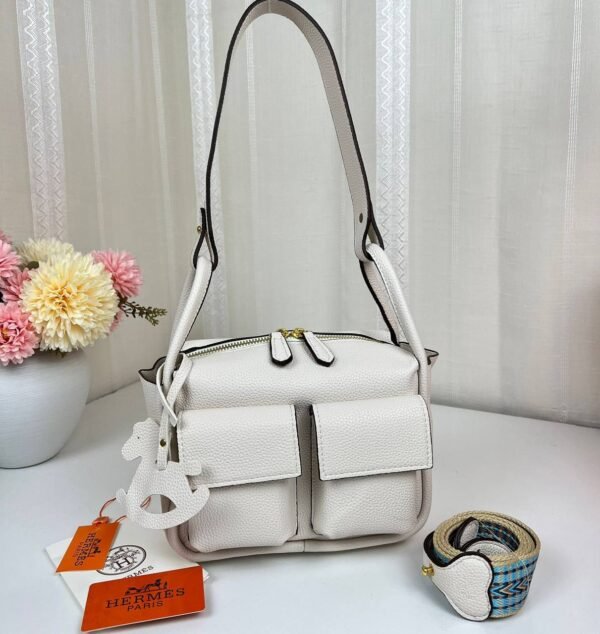 Unveil the epitome of luxury with our Hermes Shoulder Bag featuring a versatile sling strap, with original box