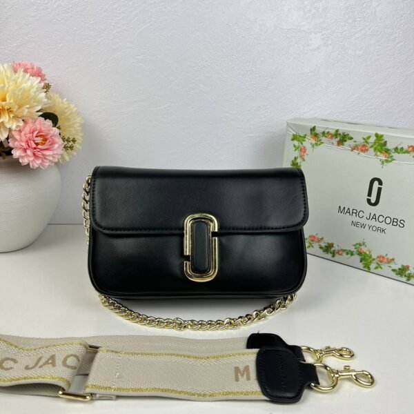 Step into the realm of urban chic with our Marc Jacobs Sling Bag, a stylish companion measuring 24*16*6 cm,