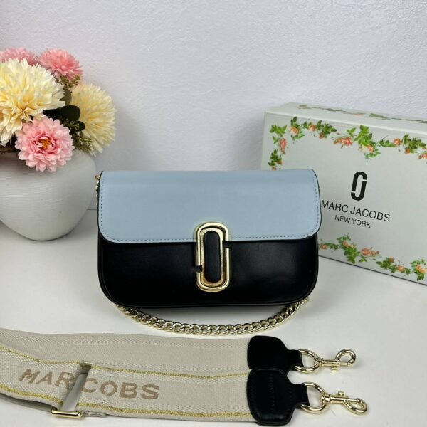 Step into the realm of urban chic with our Marc Jacobs Sling Bag, a stylish companion measuring 24*16*6 cm,