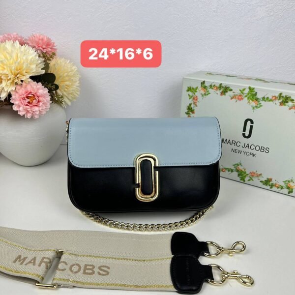 Step into the realm of urban chic with our Marc Jacobs Sling Bag, a stylish companion measuring 24*16*6 cm,