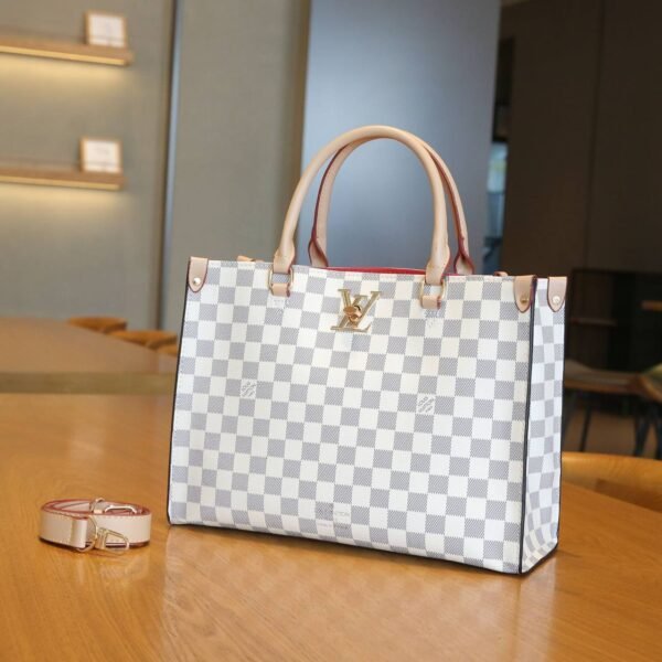 Elevate your elegance with the Louis Vuitton Tote Bag, a sophisticated masterpiece  With Box