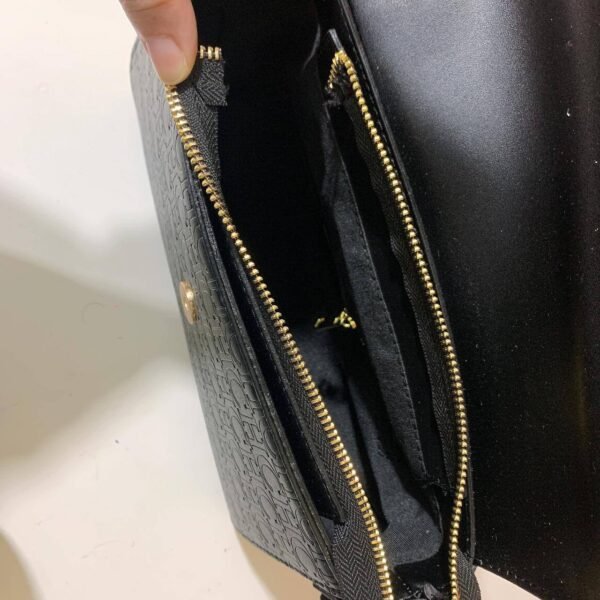 Step into sophistication with our CH Shoulder Bag, a chic accessory designed to elevate your style game