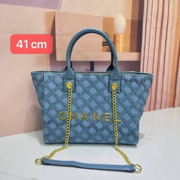 the Chanel tote bag 41 cm, it seamlessly blends timeless elegance with practicality.this bag boasts a sling belt for versatile carrying options