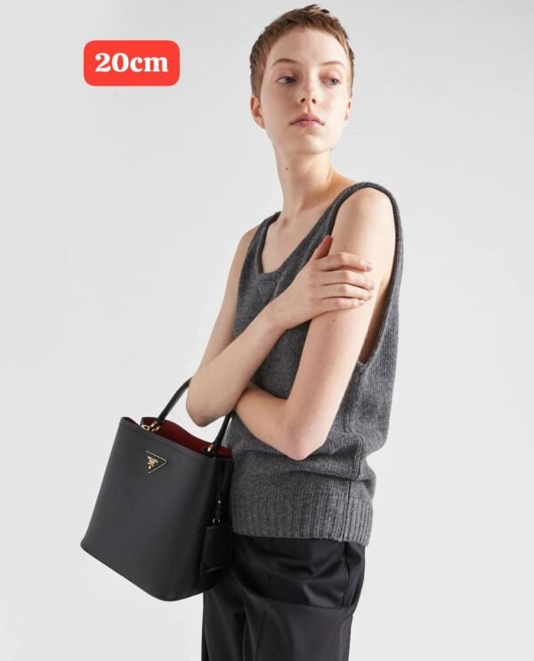 Prada handbag. Crafted with exquisite attention to detail and packaged in its original box