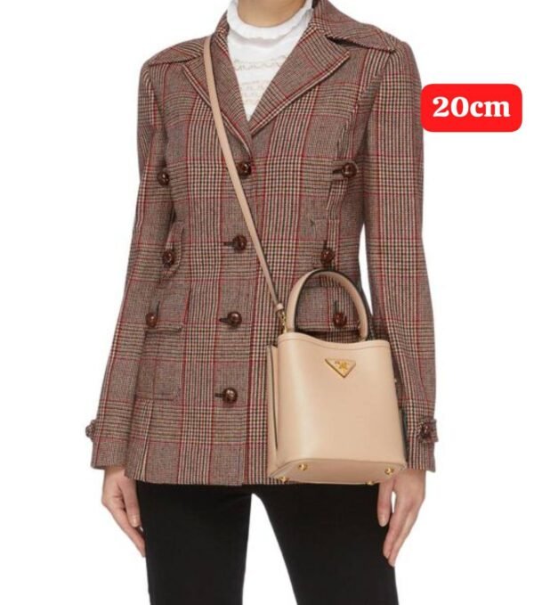 Prada handbag. Crafted with exquisite attention to detail and packaged in its original box