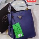 Prada handbag. Crafted with exquisite attention to detail and packaged in its original box