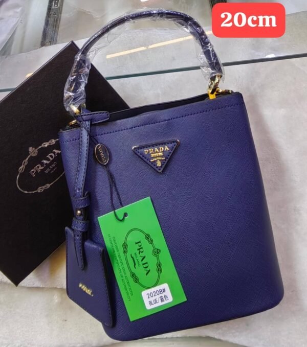 Prada handbag. Crafted with exquisite attention to detail and packaged in its original box