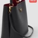 Prada handbag. Crafted with exquisite attention to detail and packaged in its original box