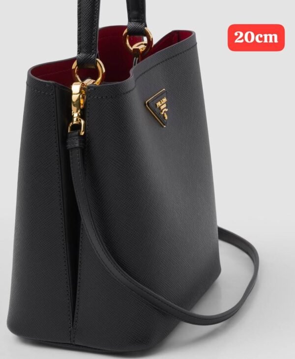 Prada handbag. Crafted with exquisite attention to detail and packaged in its original box