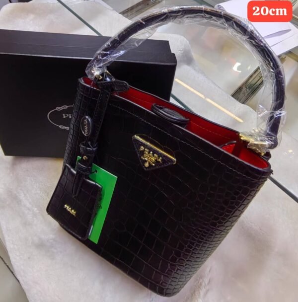 Prada handbag. Crafted with exquisite attention to detail and packaged in its original box