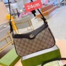 Gucci shoulder bag, adorned with the iconic logo and packaged in its original box 24 cm