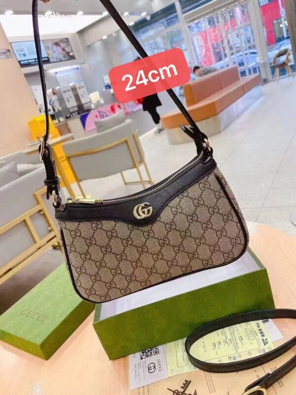 Gucci shoulder bag, adorned with the iconic logo and packaged in its original box 24 cm
