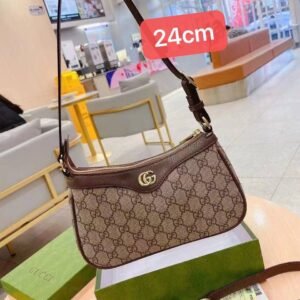 Gucci shoulder bag, adorned with the iconic logo and packaged in its original box 24 cm