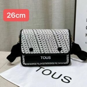 the versatile and stylish Tous sling bag, designed for both men and women with a size of 26cm