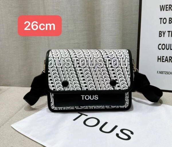 the versatile and stylish Tous sling bag, designed for both men and women with a size of 26cm