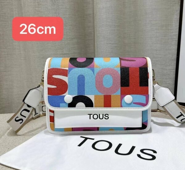 the versatile and stylish Tous sling bag, designed for both men and women with a size of 26cm