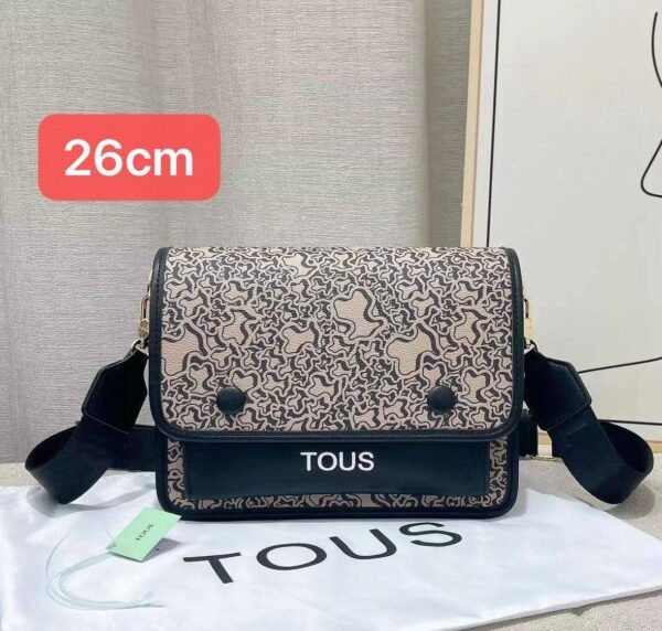 the versatile and stylish Tous sling bag, designed for both men and women with a size of 26cm