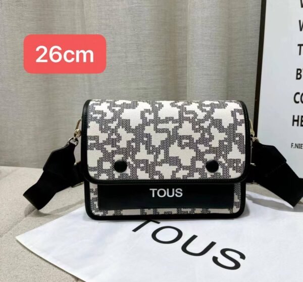 the versatile and stylish Tous sling bag, designed for both men and women with a size of 26cm