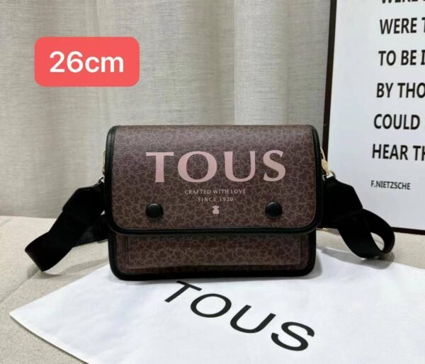 the versatile and stylish Tous sling bag, designed for both men and women with a size of 26cm