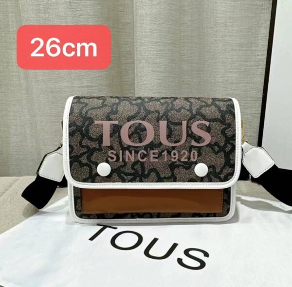 the versatile and stylish Tous sling bag, designed for both men and women with a size of 26cm