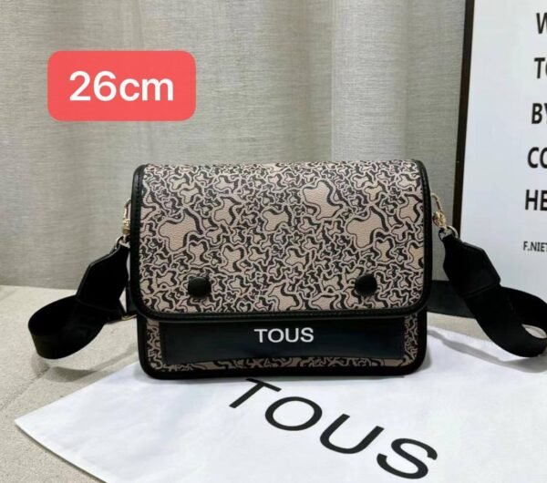 the versatile and stylish Tous sling bag, designed for both men and women with a size of 26cm