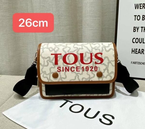 the versatile and stylish Tous sling bag, designed for both men and women with a size of 26cm