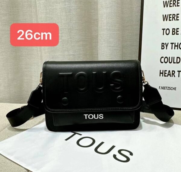 the versatile and stylish Tous sling bag, designed for both men and women with a size of 26cm