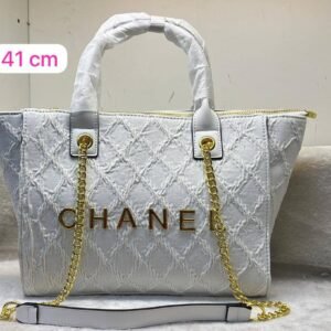 the Chanel tote bag 41 cm, it seamlessly blends timeless elegance with practicality.this bag boasts a sling belt for versatile carrying options