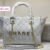 the Chanel tote bag 41 cm, it seamlessly blends timeless elegance with practicality.this bag boasts a sling belt for versatile carrying options - 4