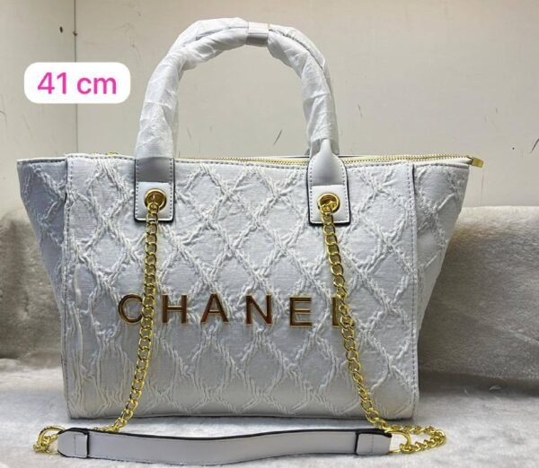 the Chanel tote bag 41 cm, it seamlessly blends timeless elegance with practicality.this bag boasts a sling belt for versatile carrying options