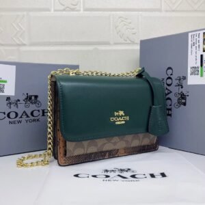the stylish and compact Coach Sling Bag, perfect for any occasion. Measuring 22 cm