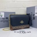 the stylish and compact Coach Sling Bag, perfect for any occasion. Measuring 22 cm - 2