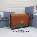 the stylish and compact Coach Sling Bag, perfect for any occasion. Measuring 22 cm - 1