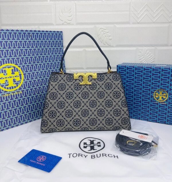 Troy Burch handbag, a perfect blend of elegance and practicality. Measuring 27 cm