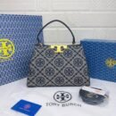 Troy Burch handbag, a perfect blend of elegance and practicality. Measuring 27 cm - 3