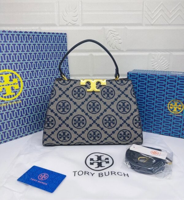 Troy Burch handbag, a perfect blend of elegance and practicality. Measuring 27 cm