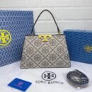 Troy Burch handbag, a perfect blend of elegance and practicality. Measuring 27 cm - 4