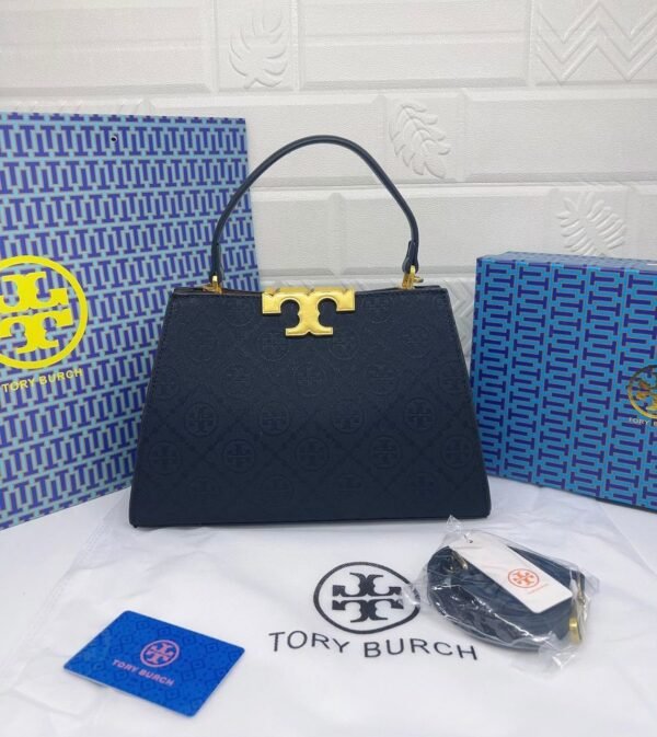 Troy Burch handbag, a perfect blend of elegance and practicality. Measuring 27 cm