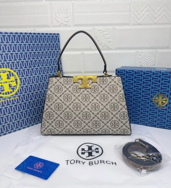 Troy Burch handbag, a perfect blend of elegance and practicality. Measuring 27 cm