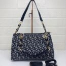 the chic and versatile DKNY Shoulder Bag, designed to elevate your everyday style. Measuring 33 cm, this bag offers ample space for your essentials - 3