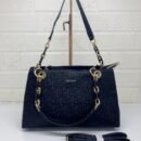 the chic and versatile DKNY Shoulder Bag, designed to elevate your everyday style. Measuring 33 cm, this bag offers ample space for your essentials - 2