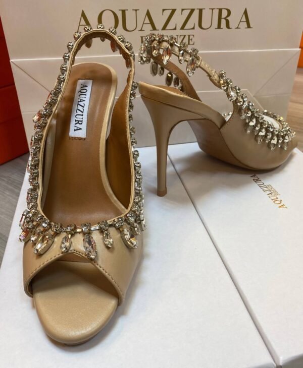 Aquazzura heels, the epitome of Italian luxury and craftsmanship. Each pair is meticulously designed to blend elegance with contemporary style