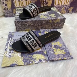 Step into elegance with shiny Dior slippers, the perfect choice for evening events